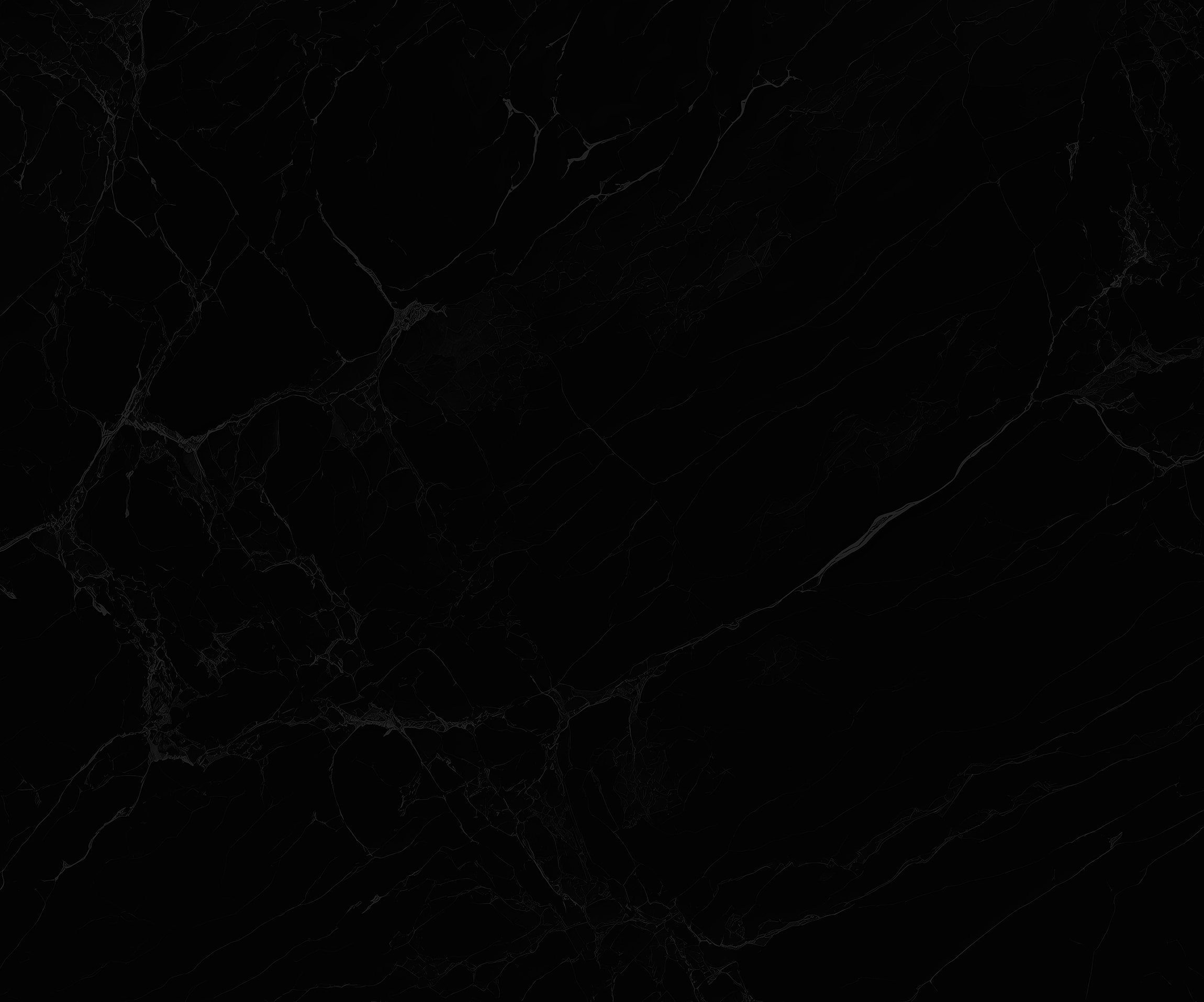 Black marble texture with white veins.
