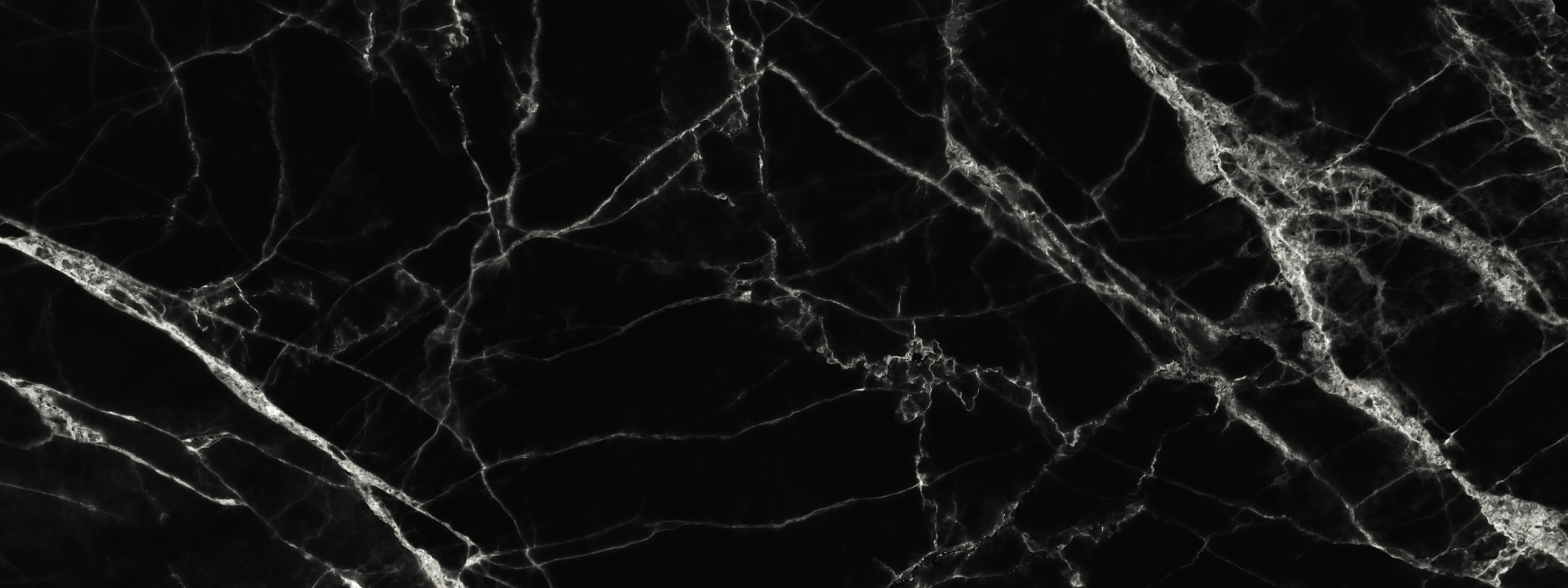 Black marble texture with white veining.