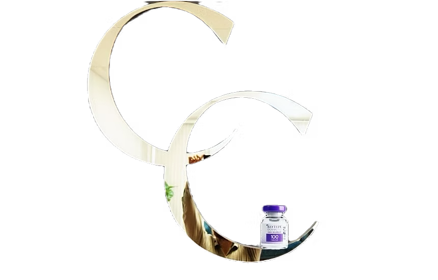Vaccine bottle beside mirrored letters CC