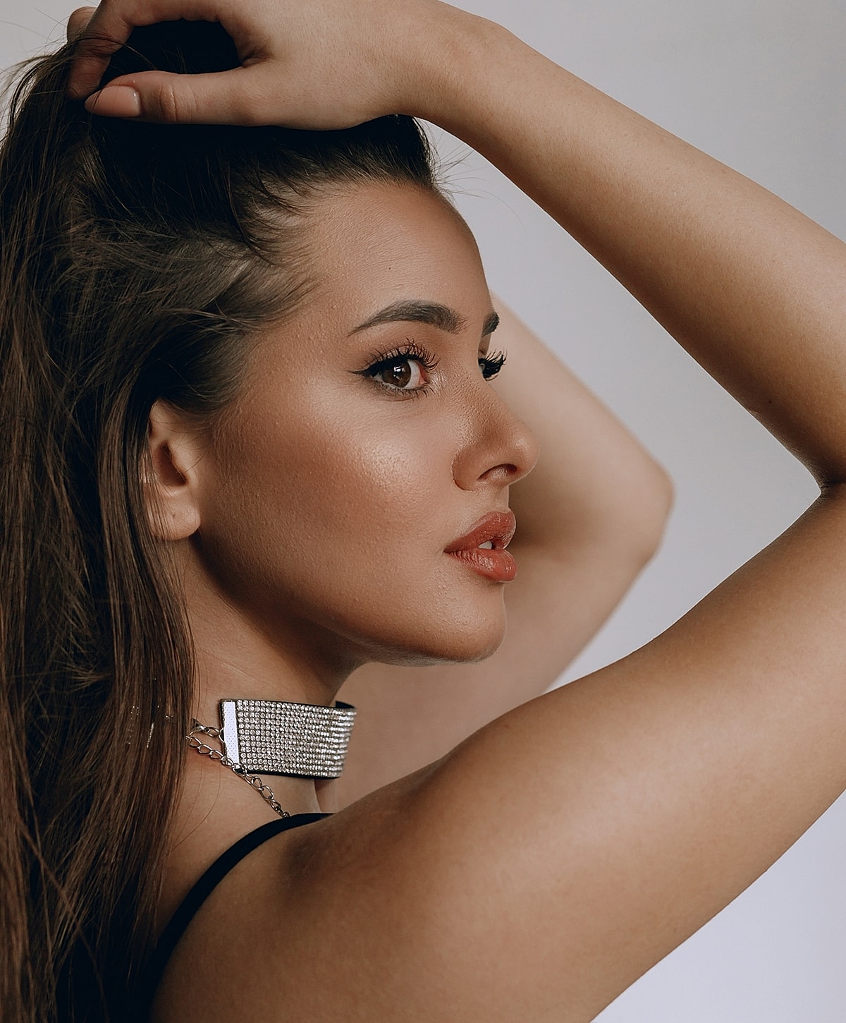 Profile of a woman with stylish accessories.